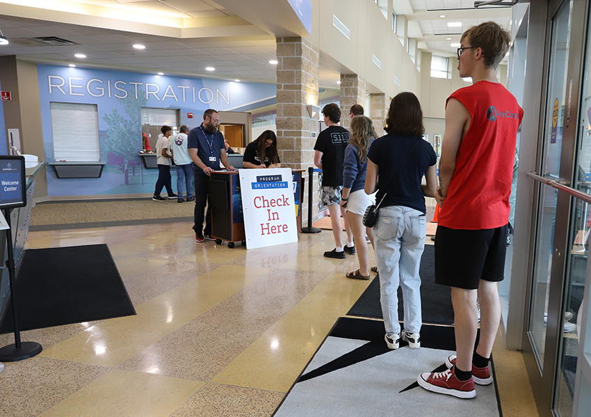Students waiting in line to check in to Program Orientations